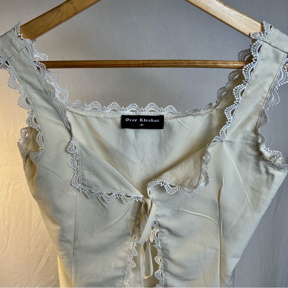 women's creme and white blouse